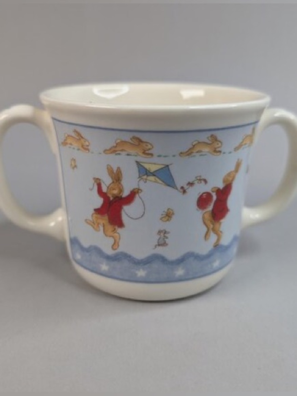 VINTAGE 2004 Royal Doulton Bunnykins two handled mug in “Shining Stars” Pattern